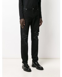 schwarze enge Jeans mit Destroyed-Effekten von Balmain