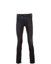 schwarze enge Jeans mit Destroyed-Effekten von RtA