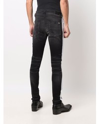 schwarze enge Jeans mit Destroyed-Effekten von Amiri