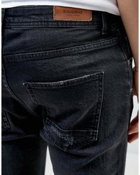 schwarze enge Jeans mit Destroyed-Effekten von Pull&Bear