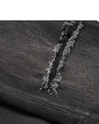 schwarze enge Jeans mit Destroyed-Effekten von Saint Laurent