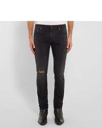 schwarze enge Jeans mit Destroyed-Effekten von Saint Laurent