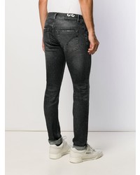 schwarze enge Jeans mit Destroyed-Effekten von Dondup