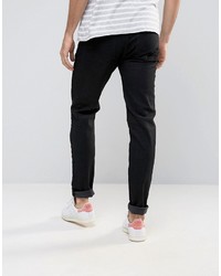 schwarze enge Jeans mit Destroyed-Effekten von Asos