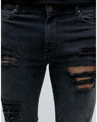 schwarze enge Jeans mit Destroyed-Effekten von Asos