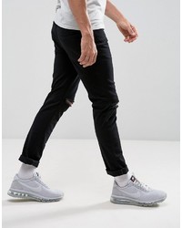 schwarze enge Jeans mit Destroyed-Effekten von Hype