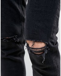 schwarze enge Jeans mit Destroyed-Effekten von Asos