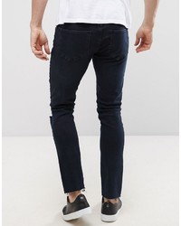 schwarze enge Jeans mit Destroyed-Effekten von Mennace