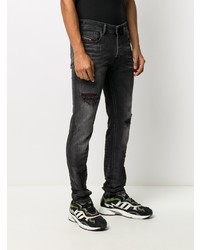 schwarze enge Jeans mit Destroyed-Effekten von Diesel