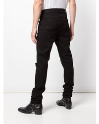 schwarze enge Jeans mit Destroyed-Effekten von Amiri