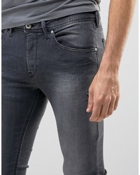 schwarze enge Jeans mit Destroyed-Effekten von Diesel