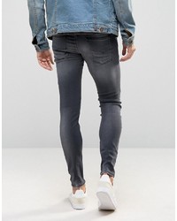 schwarze enge Jeans mit Destroyed-Effekten von Diesel