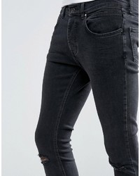 schwarze enge Jeans mit Destroyed-Effekten von Mennace