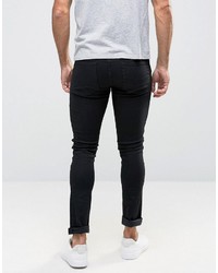 schwarze enge Jeans mit Destroyed-Effekten von Asos