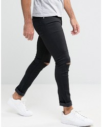 schwarze enge Jeans mit Destroyed-Effekten von Asos