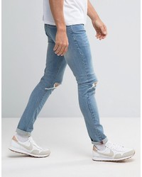 schwarze enge Jeans mit Destroyed-Effekten von Asos