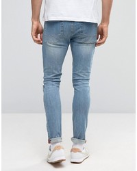 schwarze enge Jeans mit Destroyed-Effekten von Asos