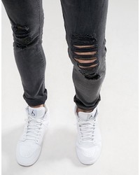 schwarze enge Jeans mit Destroyed-Effekten von Asos