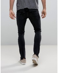 schwarze enge Jeans mit Destroyed-Effekten von Asos