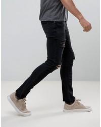 schwarze enge Jeans mit Destroyed-Effekten von Asos