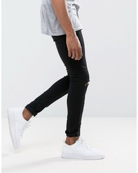 schwarze enge Jeans mit Destroyed-Effekten von Criminal Damage