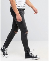 schwarze enge Jeans mit Destroyed-Effekten von Asos