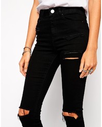 schwarze enge Jeans mit Destroyed-Effekten von Asos