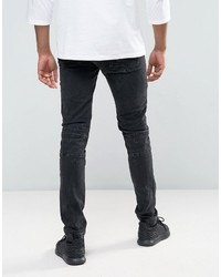 schwarze enge Jeans mit Destroyed-Effekten von Asos