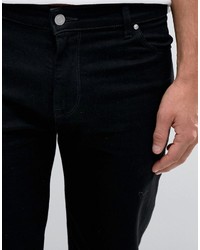 schwarze enge Jeans mit Destroyed-Effekten von Asos