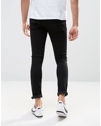 schwarze enge Jeans mit Destroyed-Effekten von Asos