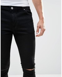 schwarze enge Jeans mit Destroyed-Effekten von Asos