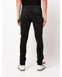 schwarze enge Jeans mit Destroyed-Effekten von Ksubi