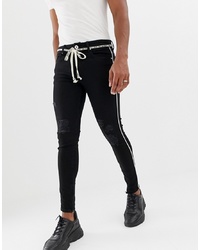 schwarze enge Jeans mit Destroyed-Effekten von The Couture Club