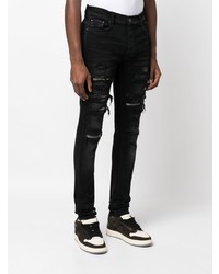 schwarze enge Jeans mit Destroyed-Effekten von Amiri