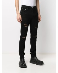 schwarze enge Jeans mit Destroyed-Effekten von Amiri