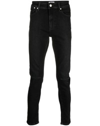 schwarze enge Jeans mit Destroyed-Effekten von Tommy Hilfiger