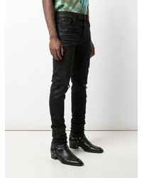 schwarze enge Jeans mit Destroyed-Effekten von Amiri