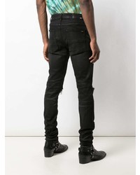 schwarze enge Jeans mit Destroyed-Effekten von Amiri