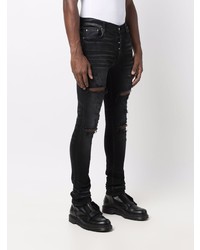 schwarze enge Jeans mit Destroyed-Effekten von Amiri