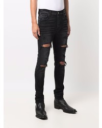 schwarze enge Jeans mit Destroyed-Effekten von Amiri