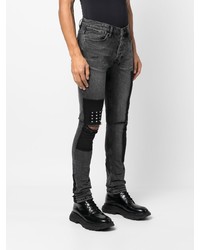 schwarze enge Jeans mit Destroyed-Effekten von Ksubi