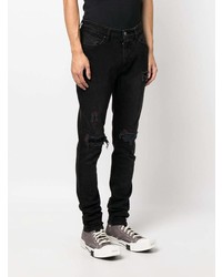 schwarze enge Jeans mit Destroyed-Effekten von Ksubi