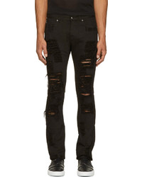 schwarze enge Jeans mit Destroyed-Effekten von Versace