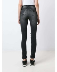 schwarze enge Jeans mit Destroyed-Effekten von Amapô