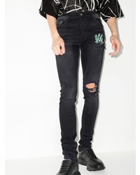 schwarze enge Jeans mit Destroyed-Effekten von Amiri