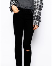 schwarze enge Jeans mit Destroyed-Effekten von Asos