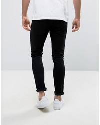 schwarze enge Jeans mit Destroyed-Effekten