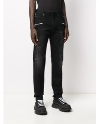 schwarze enge Jeans mit Destroyed-Effekten von Balmain