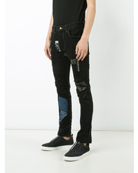 schwarze enge Jeans mit Flicken von Black Fist