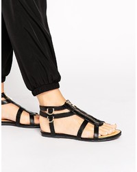 schwarze flache Sandalen aus Leder